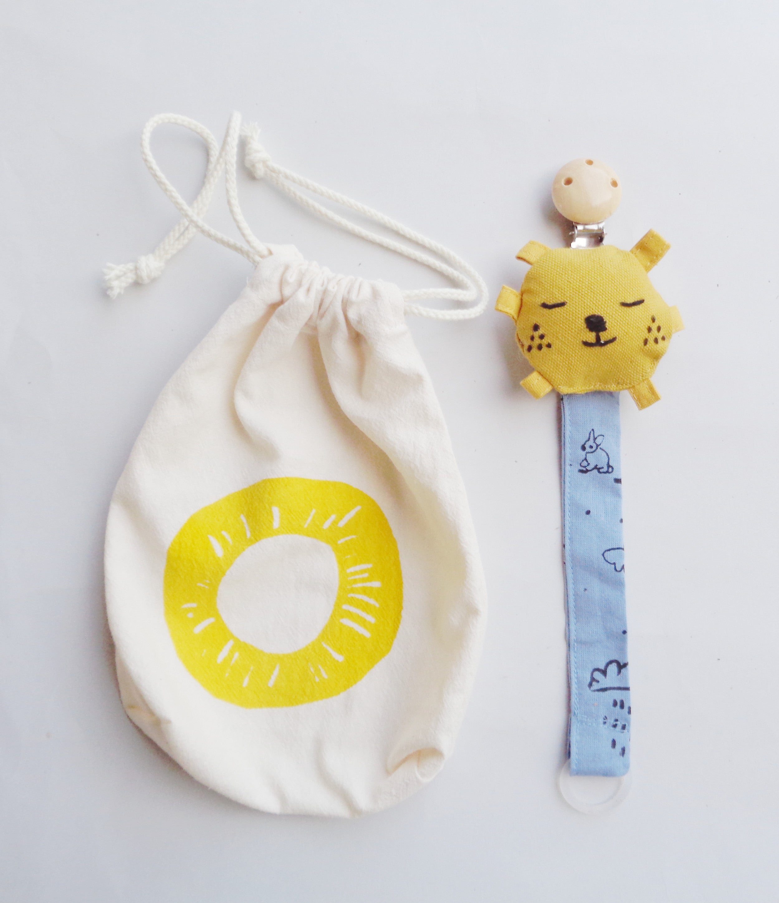 Pacifier clip with yellow stuffed sun and rain cloud strap. Eco ...