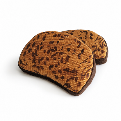 Handmade fabric rye bread slices with dark crust edges on a clean white studio background.